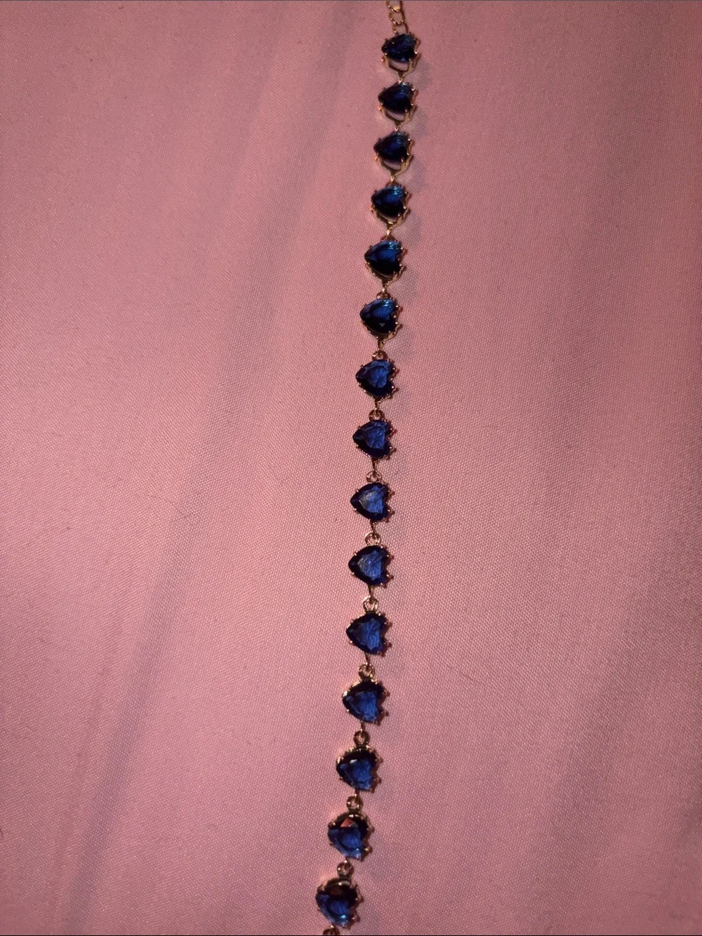 Gold Bracelet with Deep Blue Heart Gemstones